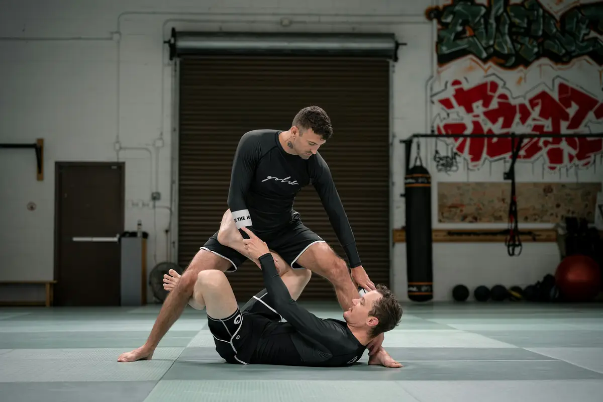 Coach Rafael Duarte running a no-gi drill